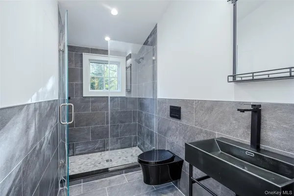a bathroom with a shower and toilet