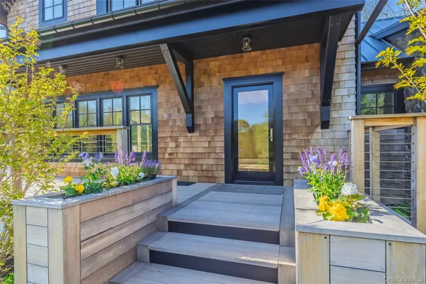 a front view of house with outdoor seating