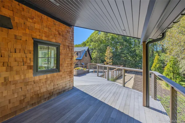a view of a balcony with wooden floor
