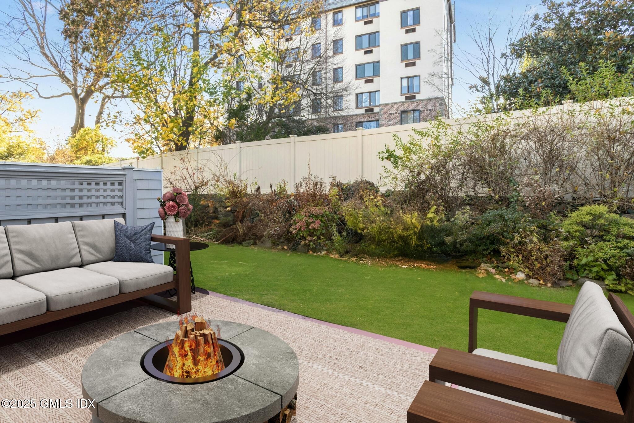 50 Church Street, Unit 5 Greenwich, CT 06830 - Photo 12 of 17 a view of a backyard with furniture and garden