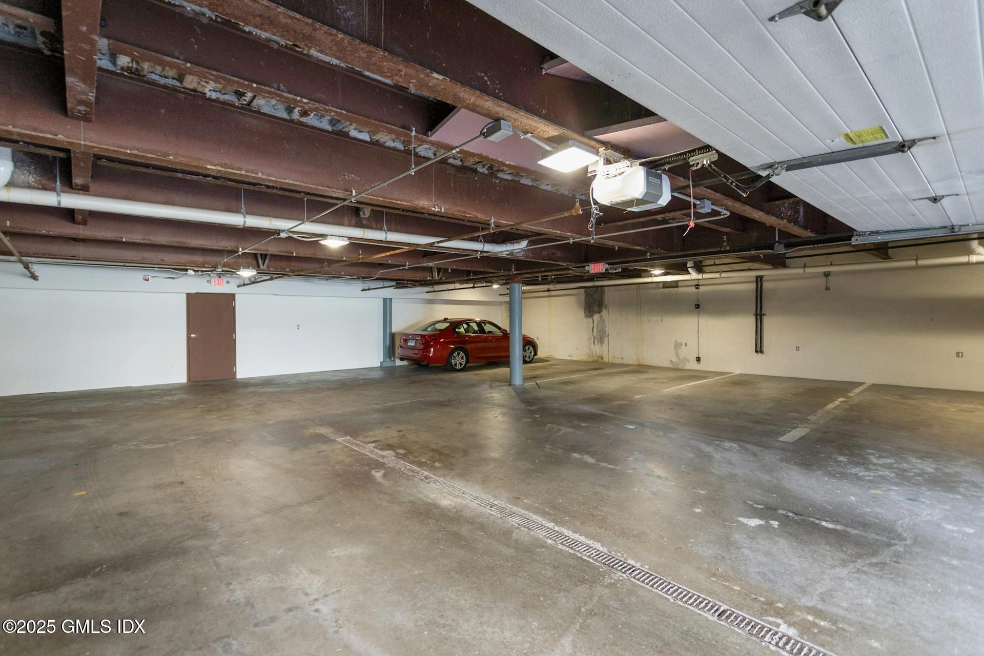 50 Church Street, Unit 5 Greenwich, CT 06830 - Photo 13 of 17 a view of parking garage with parked cars