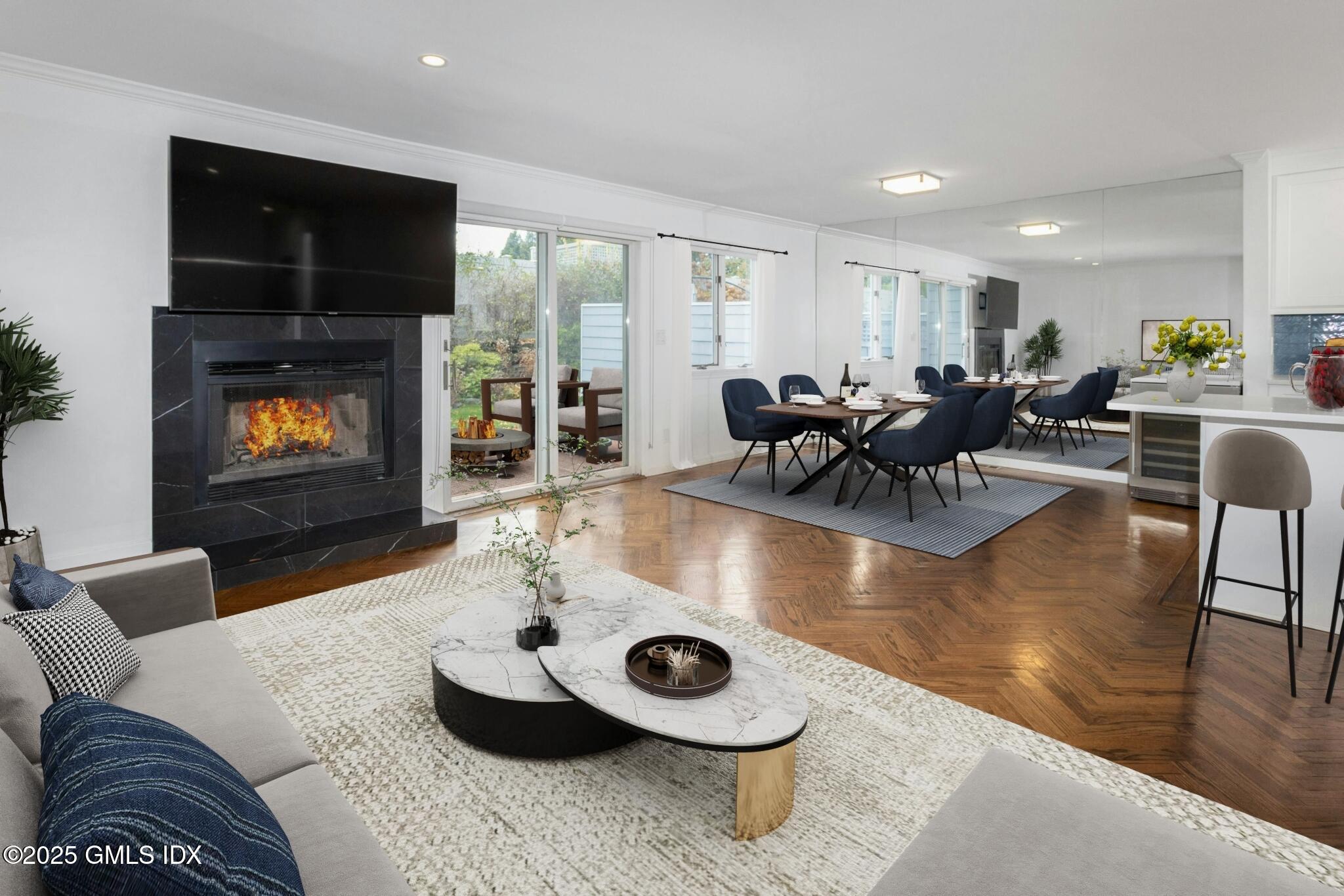 50 Church Street, Unit 5 Greenwich, CT 06830 - Photo 8 of 17 a living room with furniture and a flat screen tv