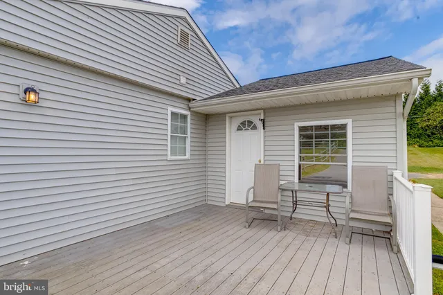 a view of a house with wooden fence