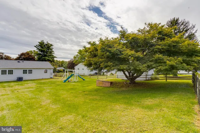 a view of a house with a big yard