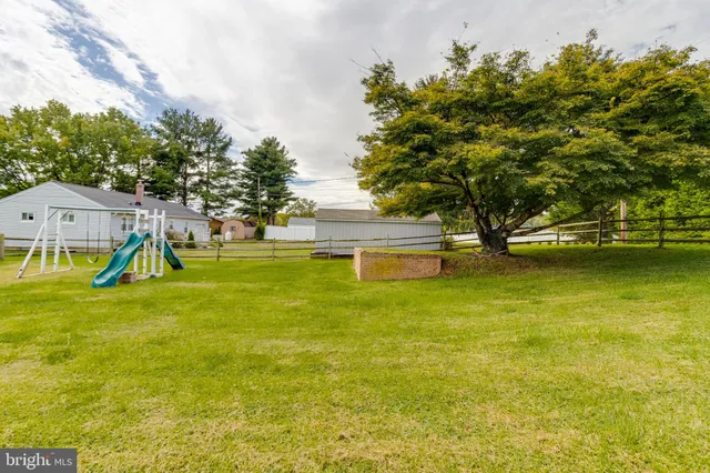 a view of a swimming pool with an outdoor space and seating area