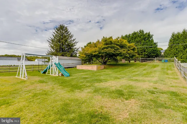 a view of a swimming pool with an outdoor space and seating area