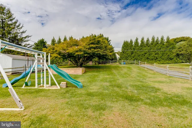 a view of a swimming pool with an outdoor space and seating area