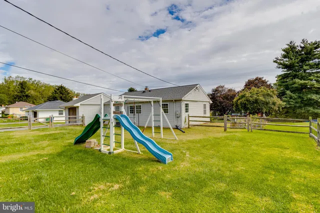 a view of a swimming pool with an outdoor space and seating area