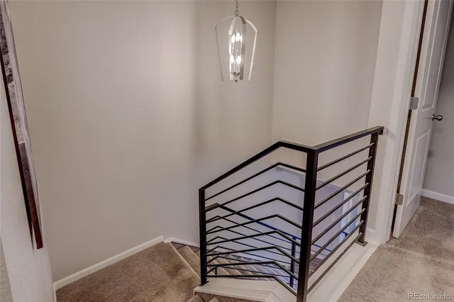 a bedroom with a large bed and a flat tv screen on dresser