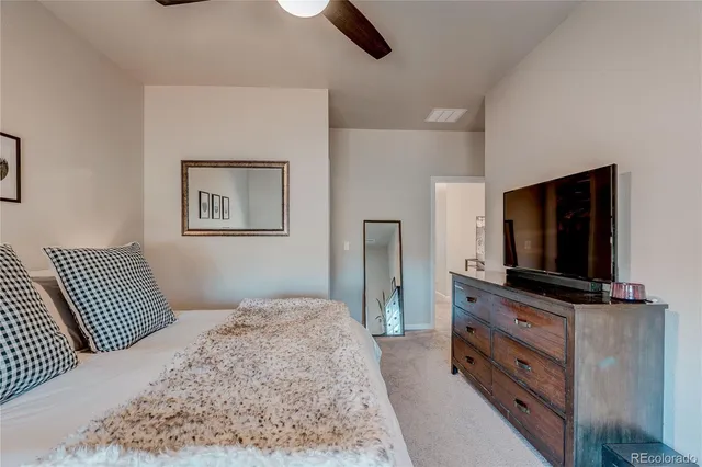 a bathroom with a sink shower and a mirror