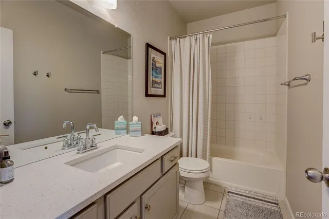 a bedroom with a bed and cabinets