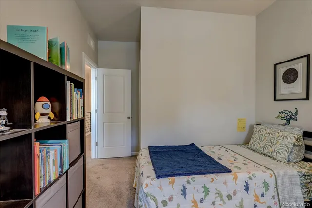 a work room with furniture and a window