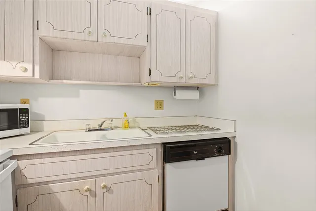 a bedroom with a large bed and a shower