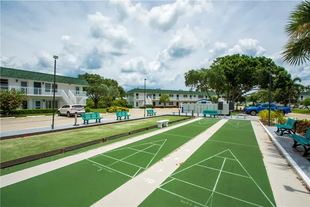 a view of swimming pool with chairs