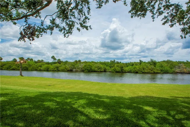 a view of a lake with a big yard