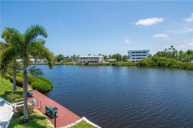 a view of swimming pool outdoor seating and lake