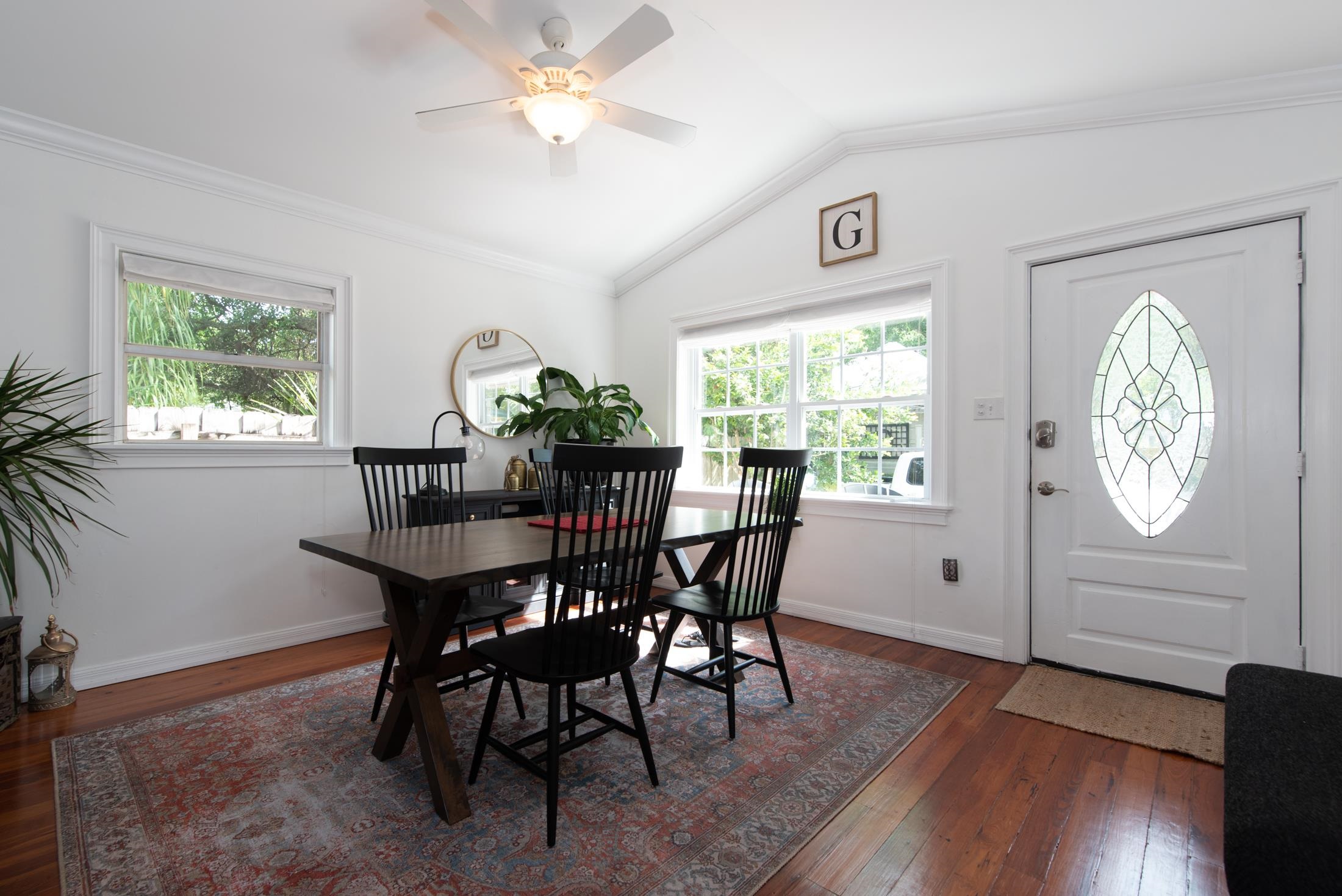 132 Oneida Street St. Augustine, FL 32084 - Photo 12 of 36 a view of a dining room with furniture window and wooden floor