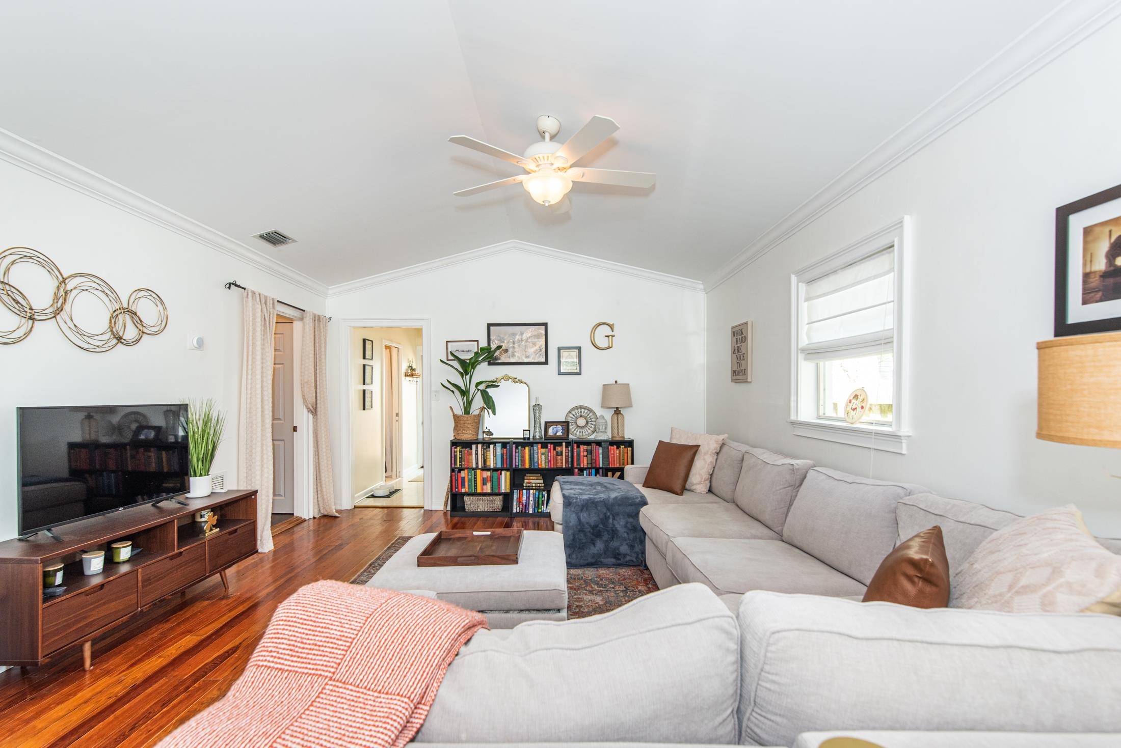132 Oneida Street St. Augustine, FL 32084 - Photo 13 of 36 a living room with furniture and a flat screen tv
