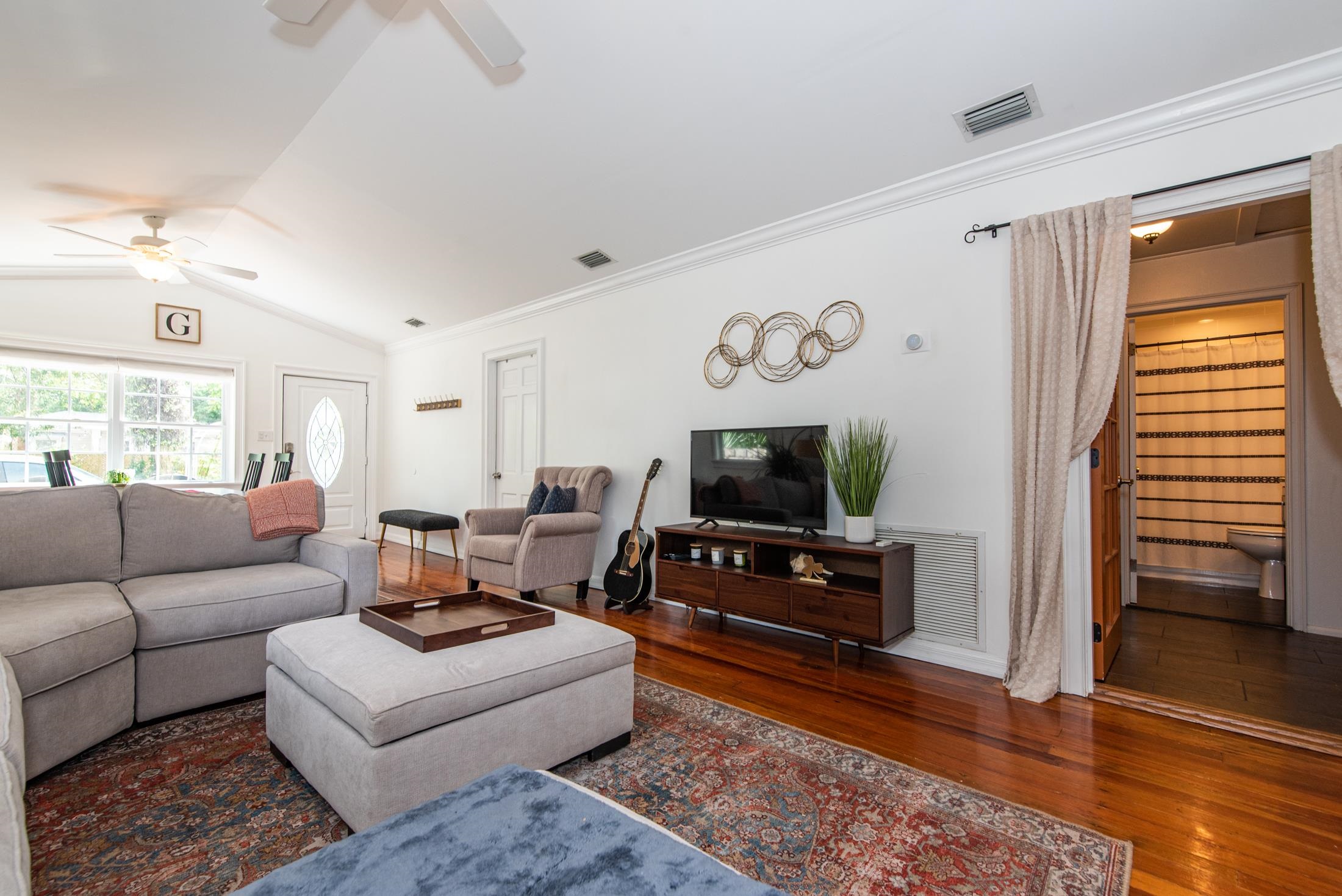132 Oneida Street St. Augustine, FL 32084 - Photo 14 of 36 a living room with furniture and a flat screen tv
