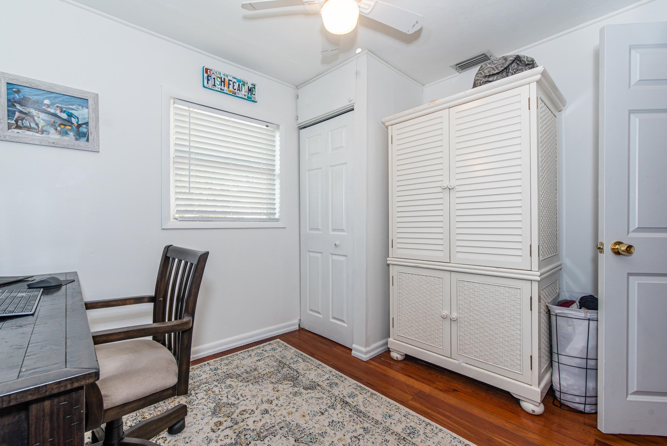 132 Oneida Street St. Augustine, FL 32084 - Photo 25 of 36 a view of a room with wooden floor and windows