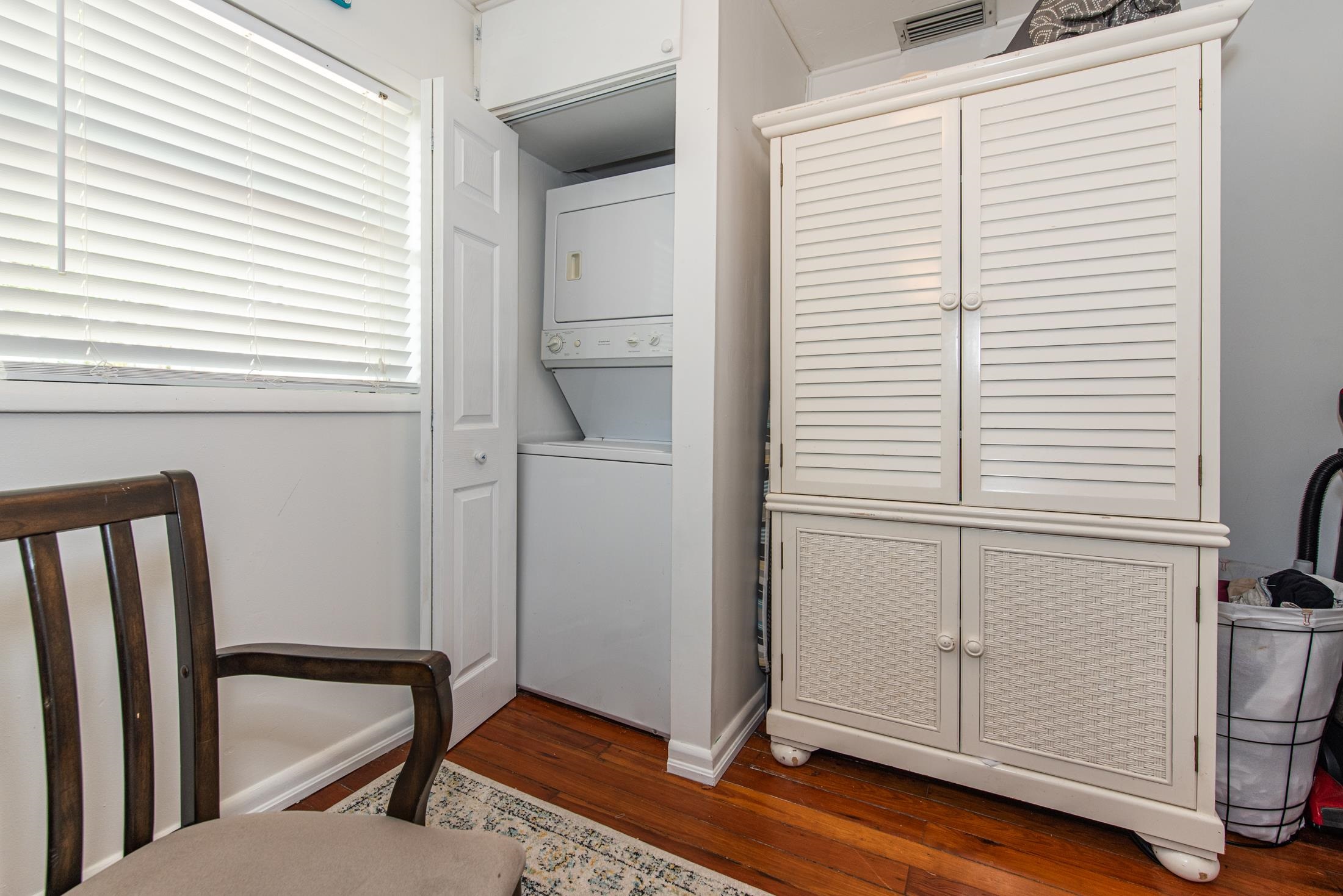 132 Oneida Street St. Augustine, FL 32084 - Photo 26 of 36 a view of an empty room with wooden floor and a window
