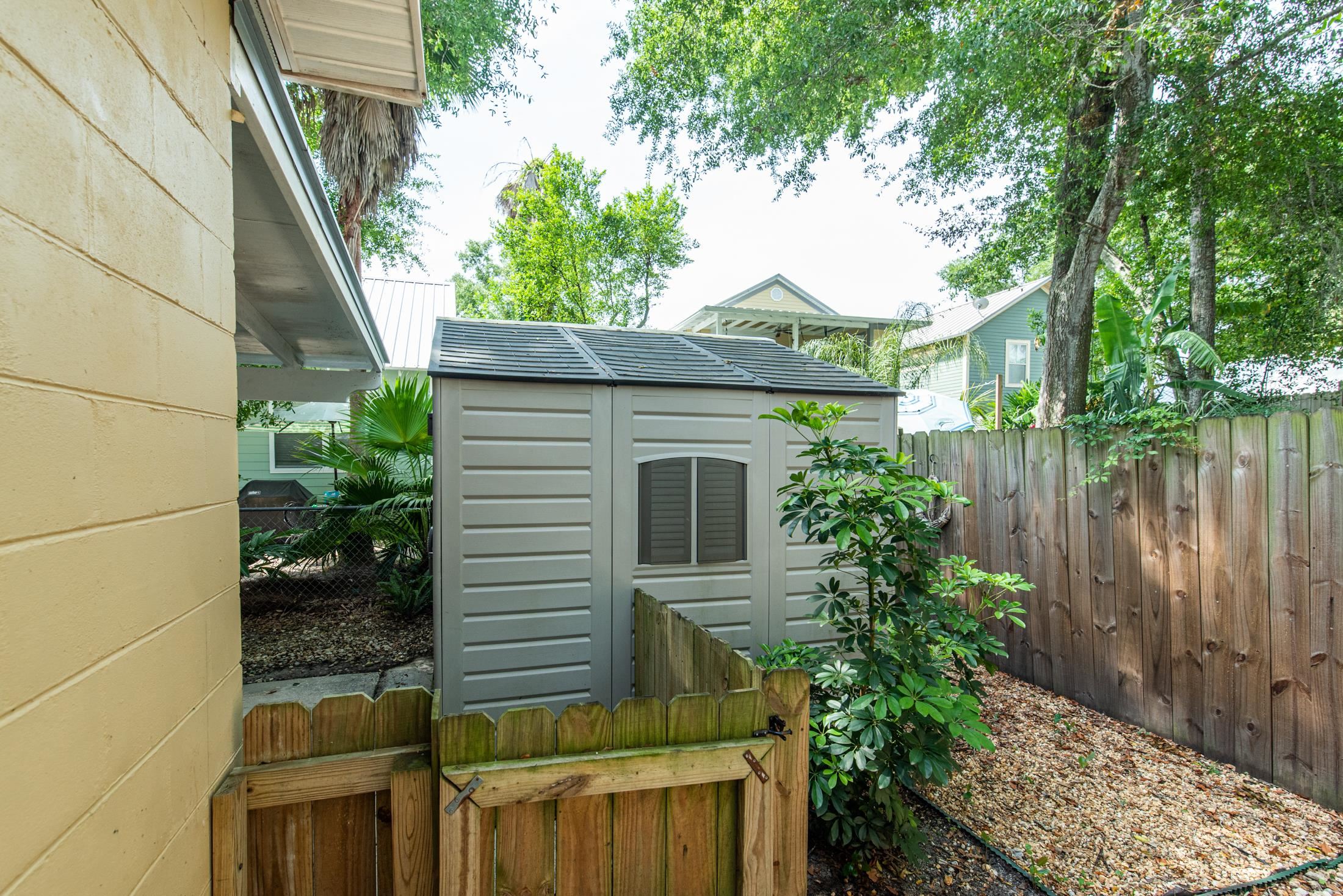 132 Oneida Street St. Augustine, FL 32084 - Photo 32 of 36 a view of a backyard with plants