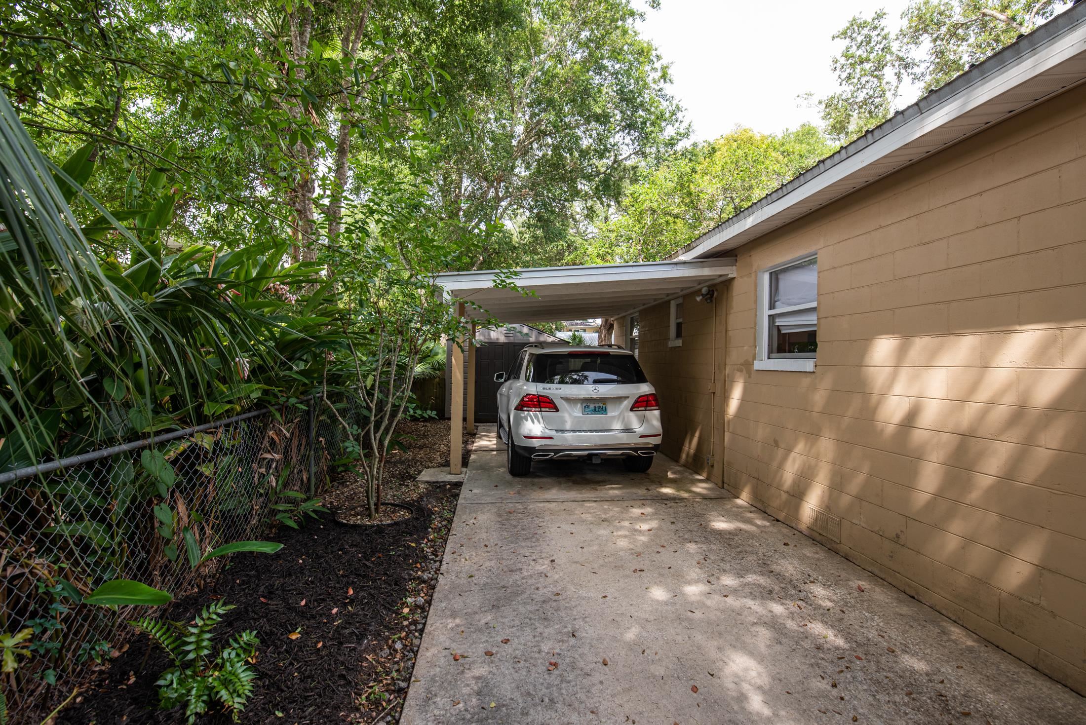 132 Oneida Street St. Augustine, FL 32084 - Photo 36 of 36 a view of a car in front of a house with large trees