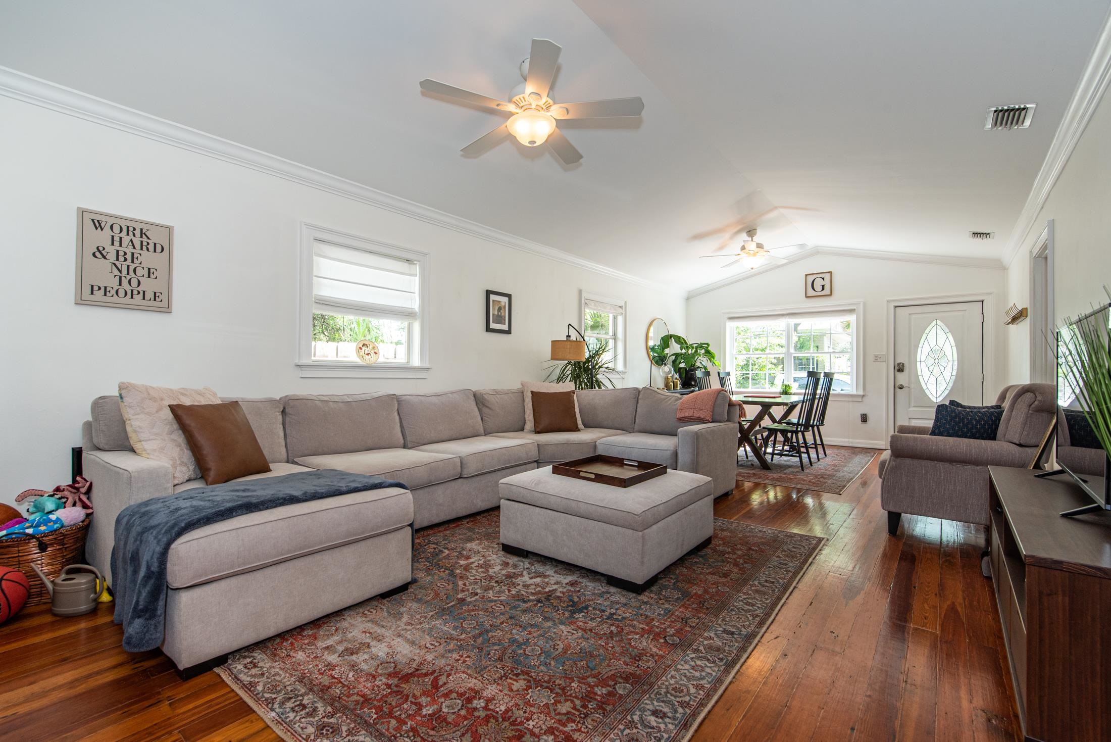 132 Oneida Street St. Augustine, FL 32084 - Photo 4 of 36 a living room with furniture ceiling fan and a rug