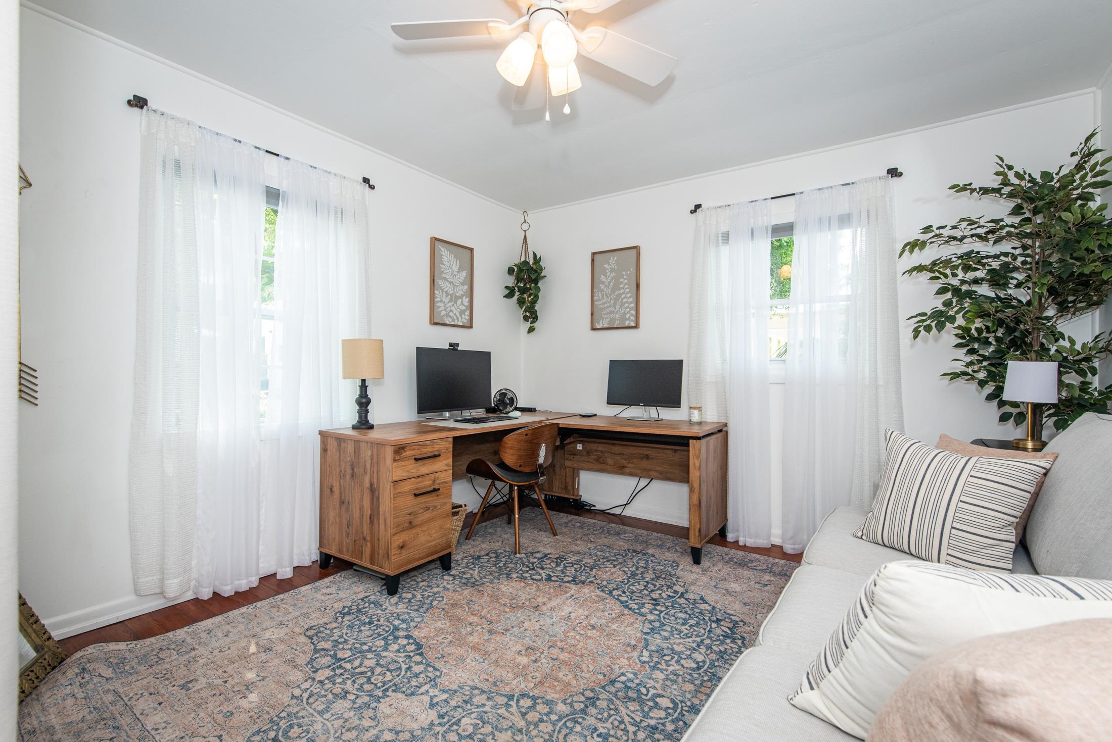 132 Oneida Street St. Augustine, FL 32084 - Photo 5 of 36 a living room with furniture a window and a potted plant