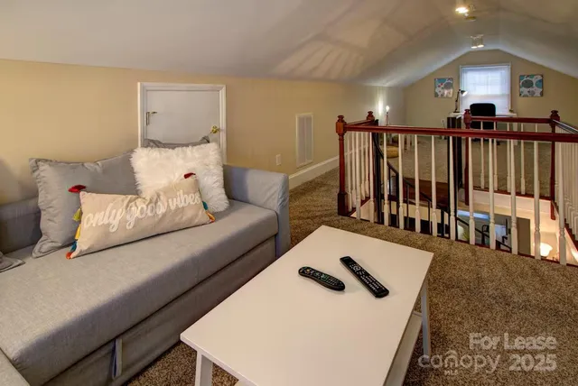 a living room with furniture and a table