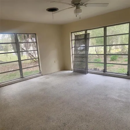 a view of an empty room with a window