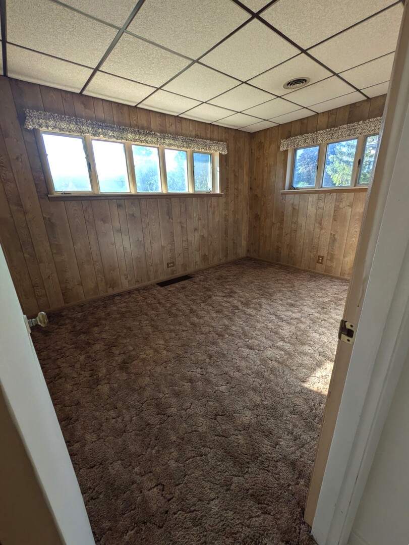 1114 Ash Street Lake In The Hills, IL 60156 - Photo 7 of 8 a view of an empty room with windows