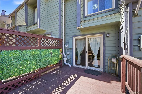 a couple of potted plants in front of a door
