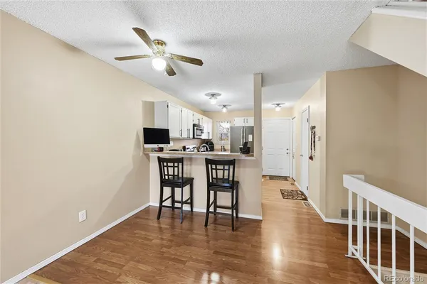 a view of a dining room with furniture and wooden floor
