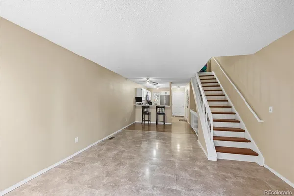a view of a room with wooden floor