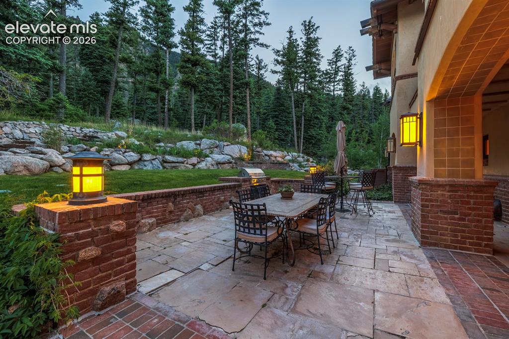 4530 Governors Point Colorado Springs, CO 80906 - Photo 29 of 49 Outdoor terrace with built in BBQ and fireplace