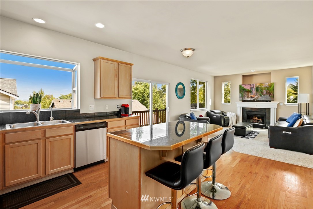322 South 21st Street Renton, WA 98055 - Photo 12 of 29 a kitchen with sink a counter and chairs