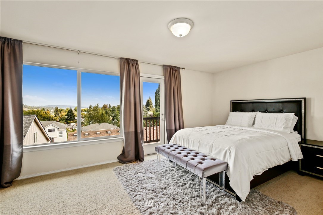 322 South 21st Street Renton, WA 98055 - Photo 16 of 29 a bedroom with a large bed and a window