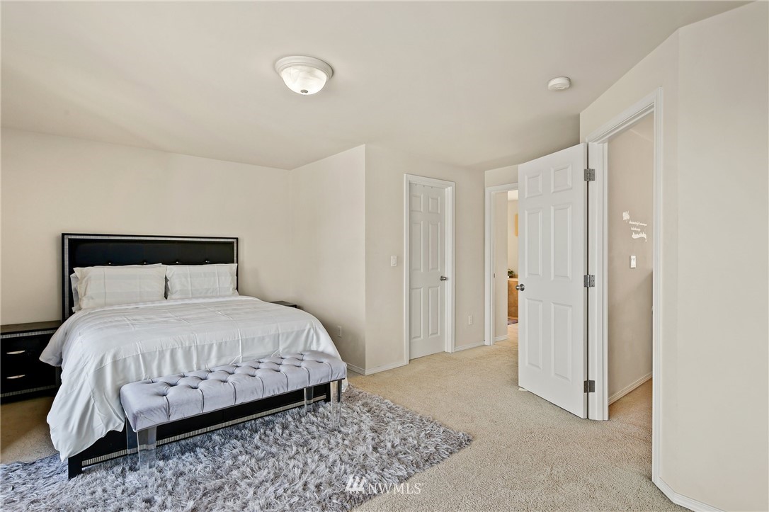 322 South 21st Street Renton, WA 98055 - Photo 17 of 29 a bedroom with a bed and a mirror