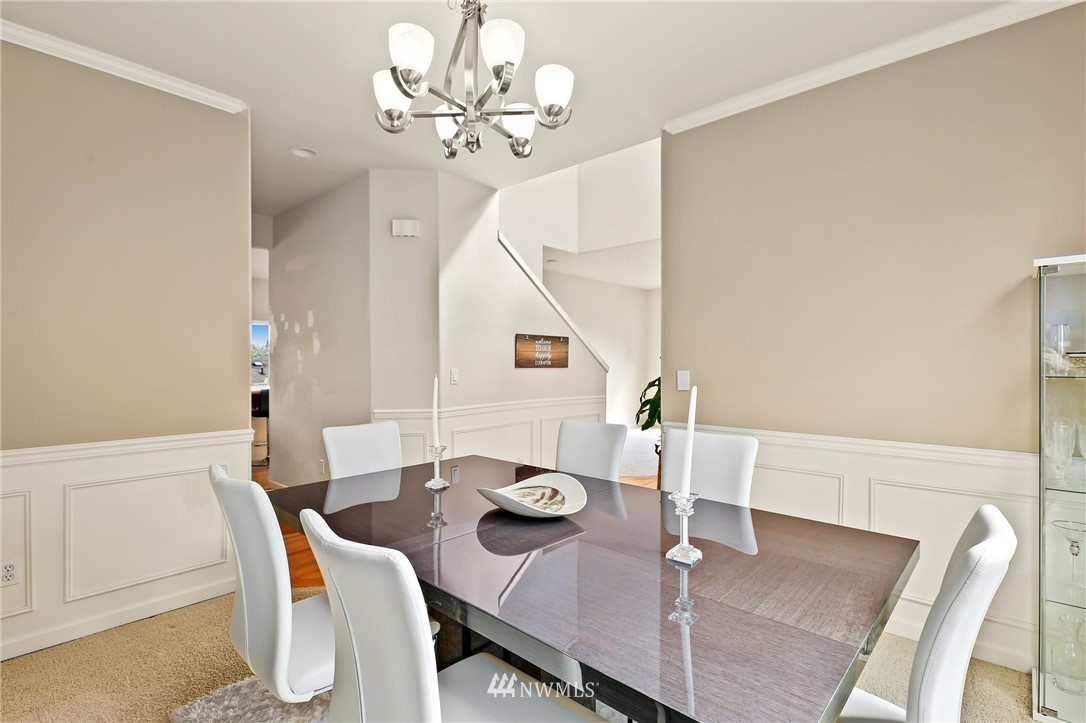 322 South 21st Street Renton, WA 98055 - Photo 3 of 29 a view of a dining room with furniture and wooden floor