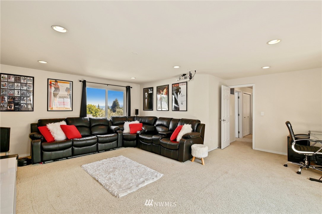 322 South 21st Street Renton, WA 98055 - Photo 23 of 29 a living room with furniture a rug and a window
