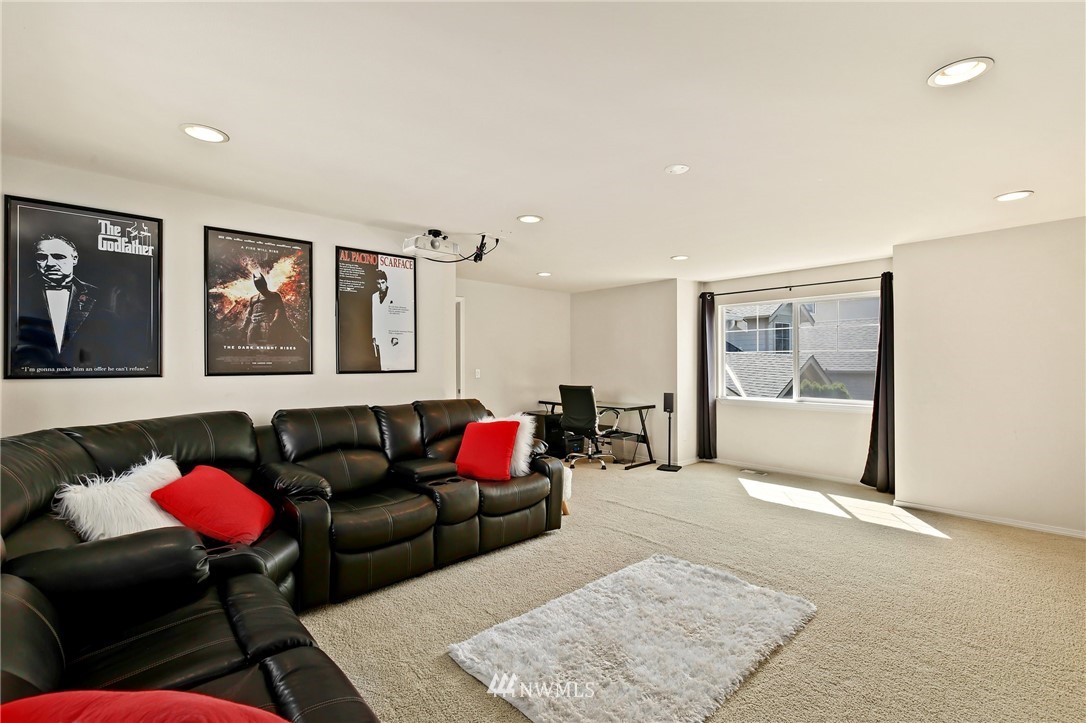 322 South 21st Street Renton, WA 98055 - Photo 24 of 29 a living room with furniture and a rug