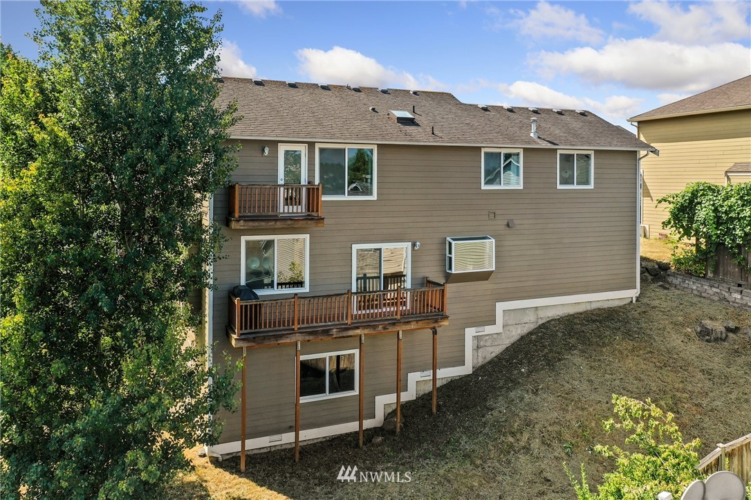 322 South 21st Street Renton, WA 98055 - Photo 26 of 29 a front view of a house with a yard
