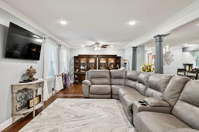 a view of a dining room with furniture window and wooden floor