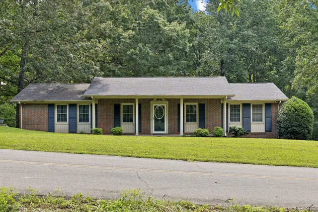 a view of dining table chairs and wooden floor