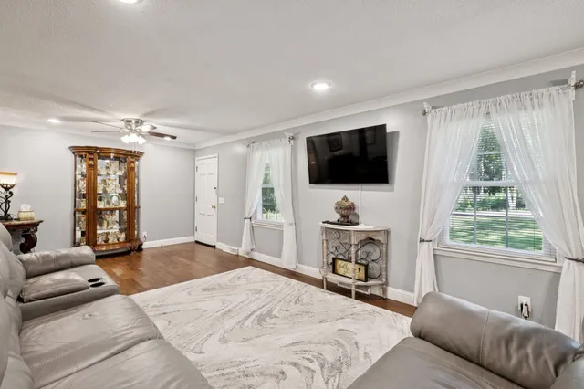 a kitchen with stainless steel appliances a stove microwave and sink