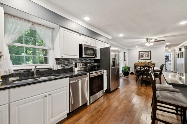 a kitchen with counter top space cabinets and stainless steel appliances