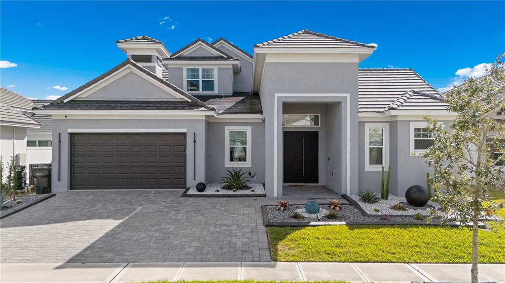 239 Hampton Loop Davenport, FL 33837 - Photo 1 of 43 a view of a house with small yard plants and palm tree