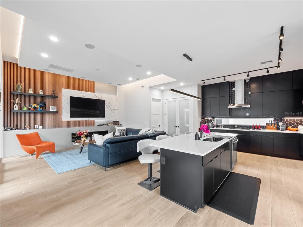 239 Hampton Loop Davenport, FL 33837 - Photo 12 of 43 a living room with furniture and a flat screen tv