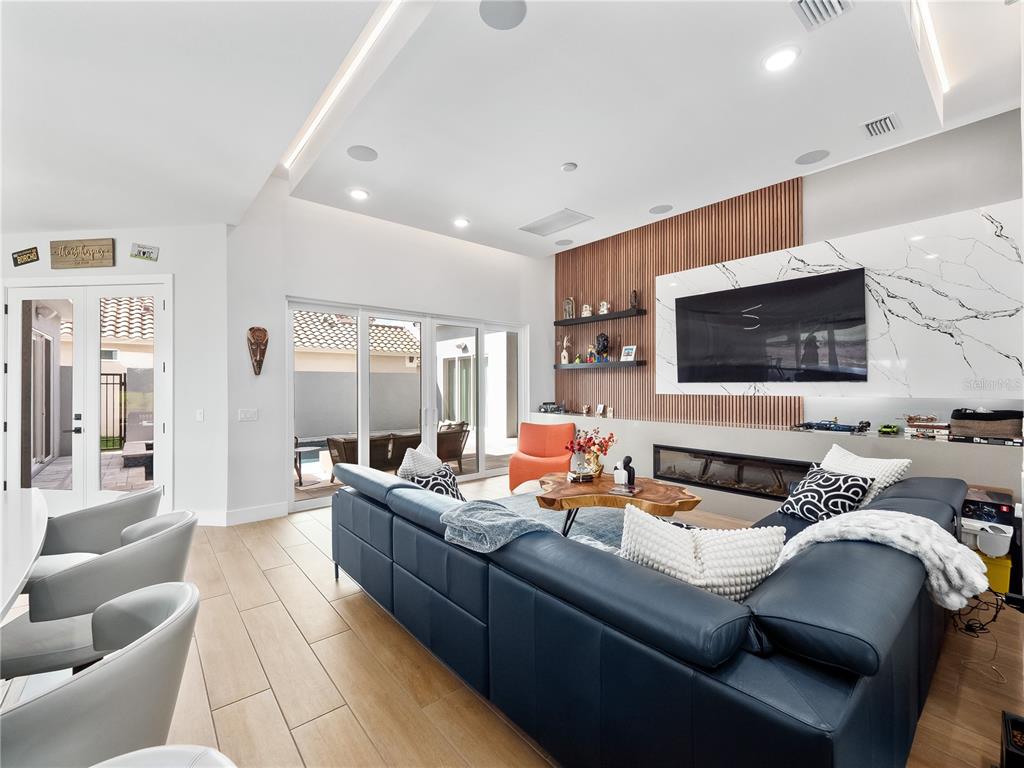239 Hampton Loop Davenport, FL 33837 - Photo 16 of 43 a living room with furniture and a flat screen tv